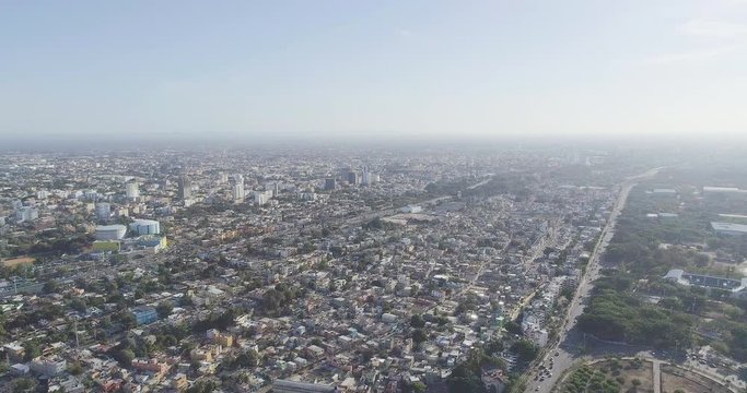 Santa Domingo Dominican Republic aerial shot. Houses street, city center, down town, street, road, sea background, beautiful drone flight.