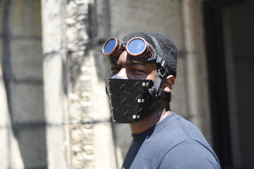 Stylish and fashion american man wearing a mask during coronavirus time. Face ultra fashion mask for protection face in pandemic isolation time. 