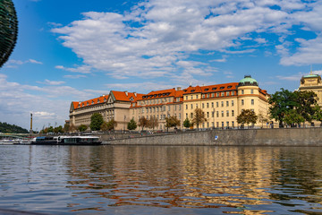 Scenic panorama cityscape view of Moldava river boat Prague in Czech Republic.