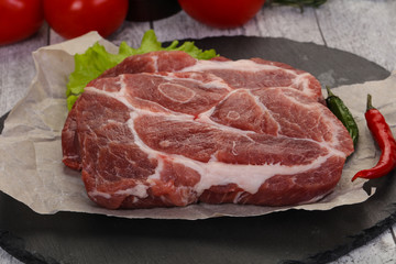 Raw pork neck steak