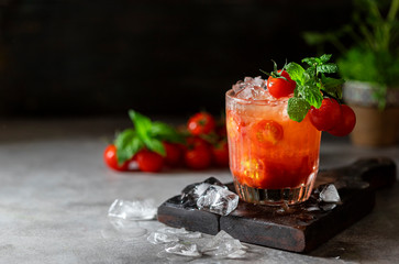 Ice tomato juice in a glass goblet.