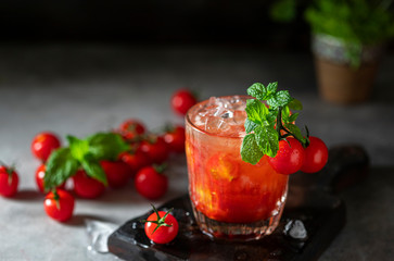 Ice tomato juice in a glass goblet.