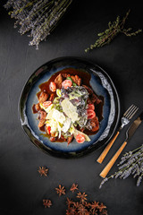 Gourmet warm beef salad white sauce and greens