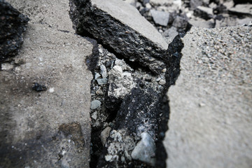 Repaving work. Asphalt pieces, pieces of broken asphalt, repairs