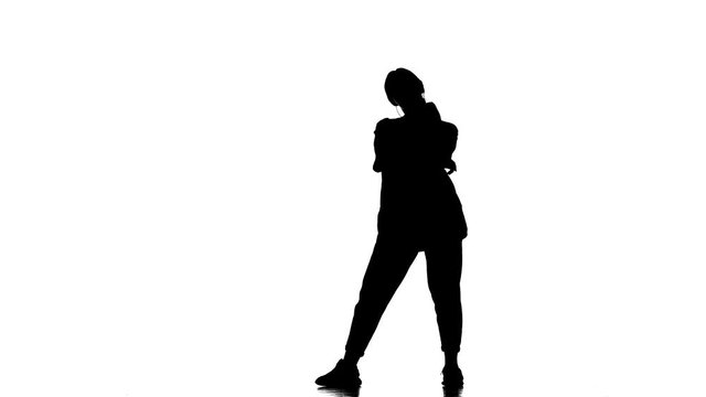 black silhouette on a white background, young beautiful girl dancer dancing hip hop, contemporary, modern street dance, slow motion