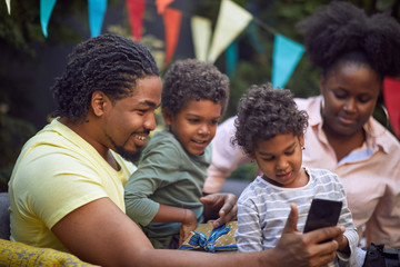afro-american family  at birthday party have fun and making selfie.