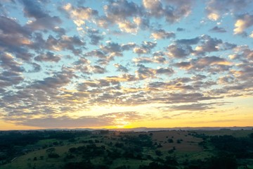 Aerial view of dramatic sky in the ranch. Rural life scene. Countryside landscape. 