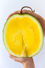 Sliced Yellow Watermelon in Hands