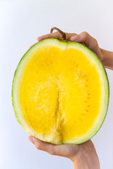 Sliced Yellow Watermelon in Hands