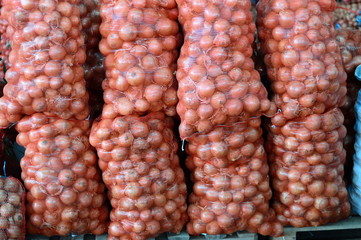 Bags with onion at market
