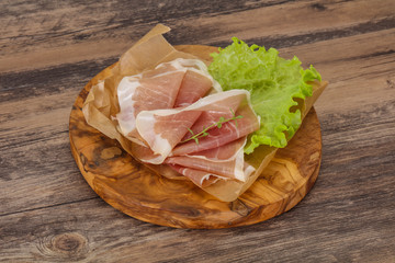 Italian prosciutto pork meat over board
