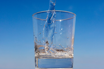 glass of water with the sky in the background