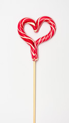 Lollipops in the shape of a heart. Bright candy. Love concept and Valentine day, vertical, 16:9