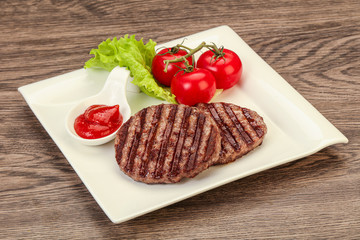 Grilled burger cutlet with sauce