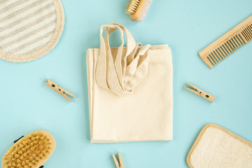 Zero Waste Cotton Bag. Zero Waste Set For Bathing On A Light Blue Background.   Natural sisal brush, wooden comb, sea salt, bamboo toothbrush, washcloth and cotton swabs.  Top view, flat lay