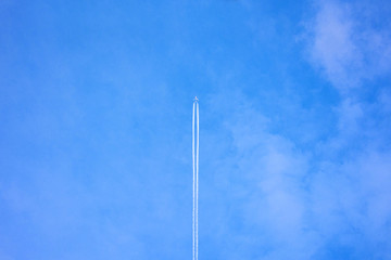 Blue sky, plane in the sky, abstract background, copy space