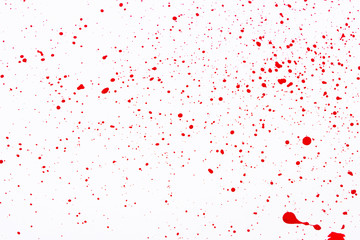 Red paint splashes. Colorful red paint explosion on white background, texture