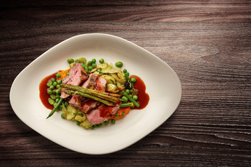 Stylish Nouvelle Cuisine plate of beef on vegetables