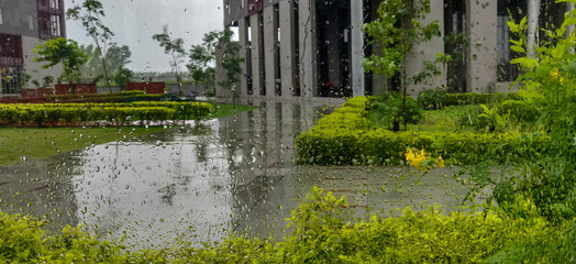 Raindrops on the window on a rainy day.
