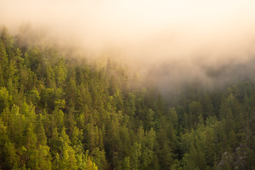 Cloudy mountains on the Telemark canal in Norway on a summer morning