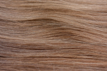 Obraz premium Beautiful wavy hair texture, brown hair