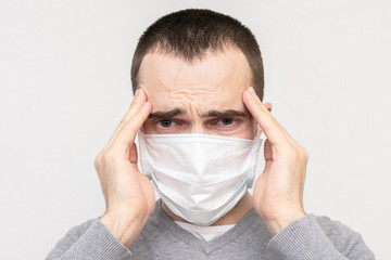 Man got sick with flu, man in a medical mask is not feeling well, portrait, white background,