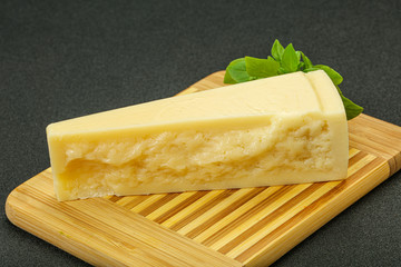 Hard parmesan cheese served basil