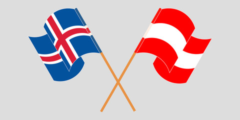 Crossed and waving flags of Iceland and Austria