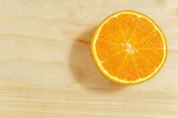 Orange slice on wooden background