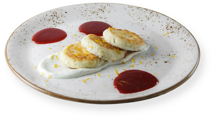 Curd pancakes with sour cream and jam. white background.
