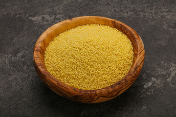 Raw cous cous heap in the bowl