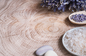 Aromatherapy, spa concept 
Sea ​​salt and lavender on a wooden background
Copy space