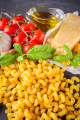concept of traditional italian pasta with tomatoes and basil