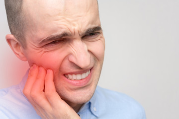 Fototapeta premium Man's teeth hurt, portrait, closeup