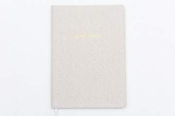 Grey notepad on white background, top view, copy space
