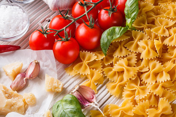 concept of traditional italian pasta with tomatoes and basil