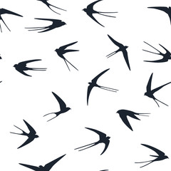 Flying swallows birds silhouettes vector seamless pattern graphic design.