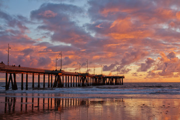 Fototapeta na wymiar pier against the backdrop of the setting sun in California