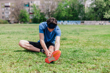 Athlete does warm-up before running at stadium