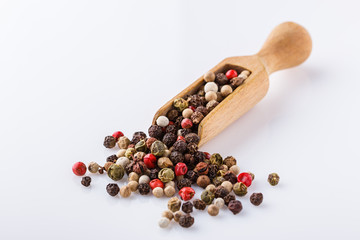 mix of peppercorns on white acrylic background