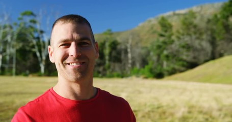 Male trainer writing on a clipboard in the boot camp