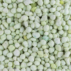 Green chemical fertilizer background. Gardening time.