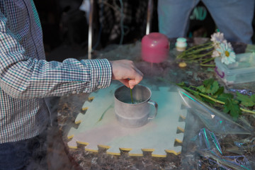 Chemical experiment, show with liquid nitrogen . researcher in uniform and goggles is conducting an experiment with liquid . Steam of Nitrogen Created from Liquid Nitrogen Exposed to Temperatures .