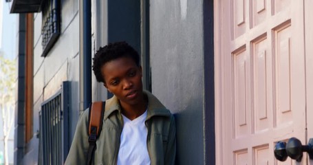 Woman looking at twin sister in the city - Powered by Adobe