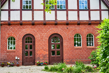Fototapeta na wymiar Former historic fire station with a brick facade and half-timbering in Berlin, Germany.