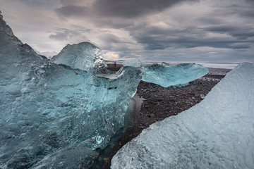 The famous Diamond beach in South Iceland. Giant ice gems on the black lava beach, placed near Jokulsarlon glacier lagoon.