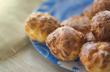 Homemade cakes or muffins on blue plate. Selective focus.