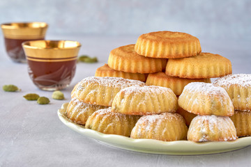 Arab sweets. Traditional eid semolina  maamoul or mamoul  cookies with dates and pistachio nuts