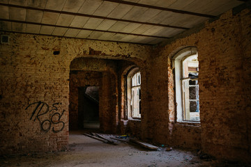 old brick destroyed building. Ruined walls and windows