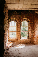 Fototapeta na wymiar old brick destroyed building. Ruined walls and windows